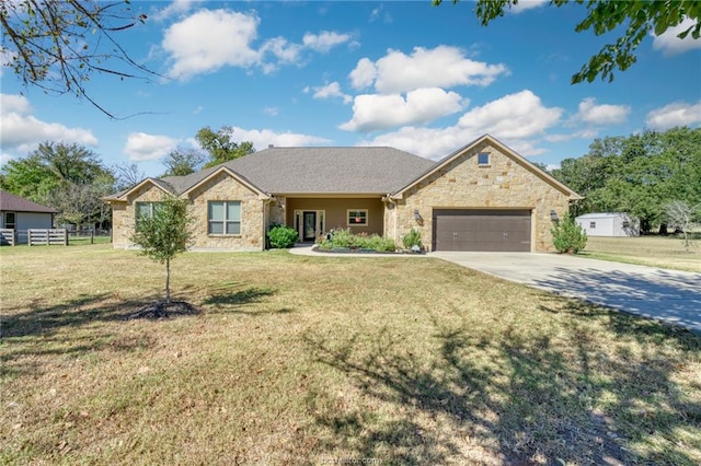 ranch-style home with a garage and a front yard