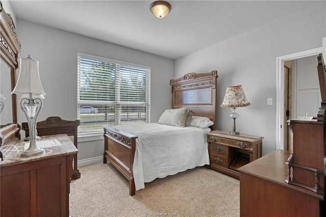 bedroom with light carpet