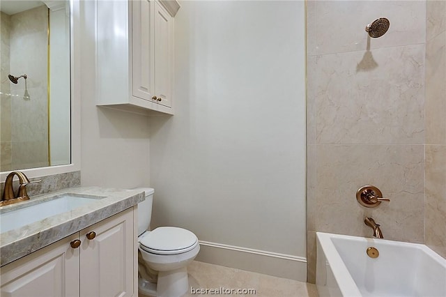 full bathroom featuring tile patterned flooring, toilet, vanity, and tiled shower / bath