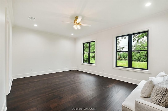 unfurnished living room featuring ceiling fan, dark wood-type flooring, and a healthy amount of sunlight