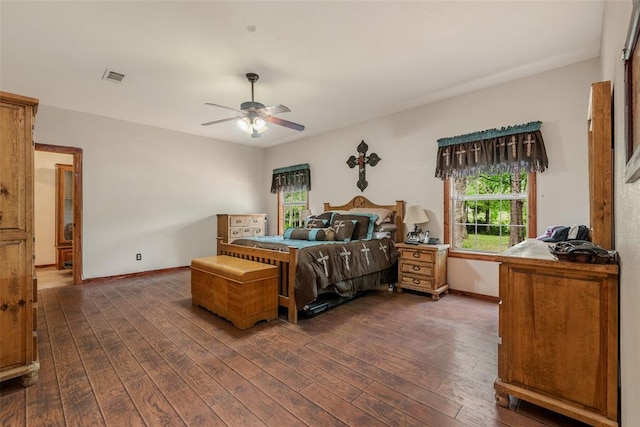 bedroom with dark wood-type flooring and ceiling fan