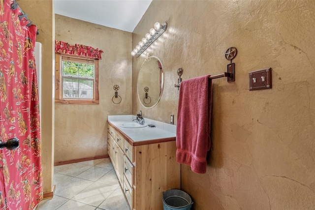 bathroom with tile patterned floors and vanity