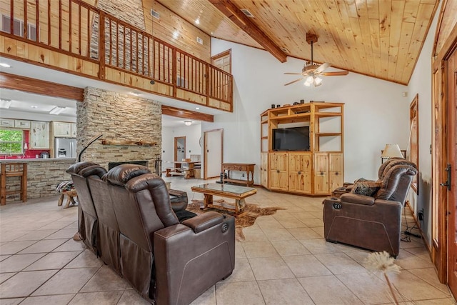 tiled living room featuring high vaulted ceiling, a fireplace, ceiling fan, wooden ceiling, and beam ceiling