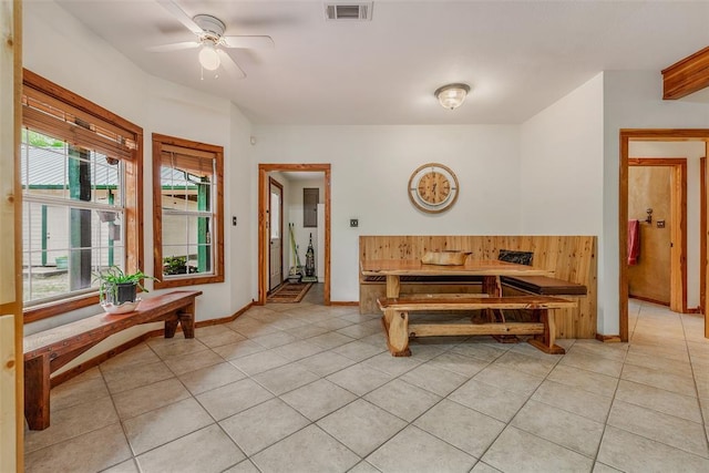 dining room featuring light tile patterned floors and ceiling fan