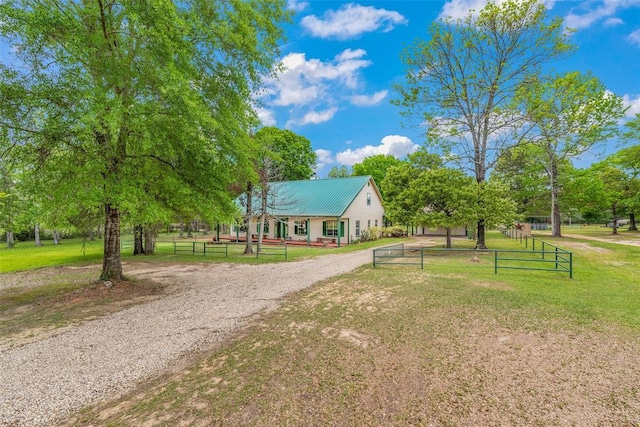 view of home's community featuring a yard