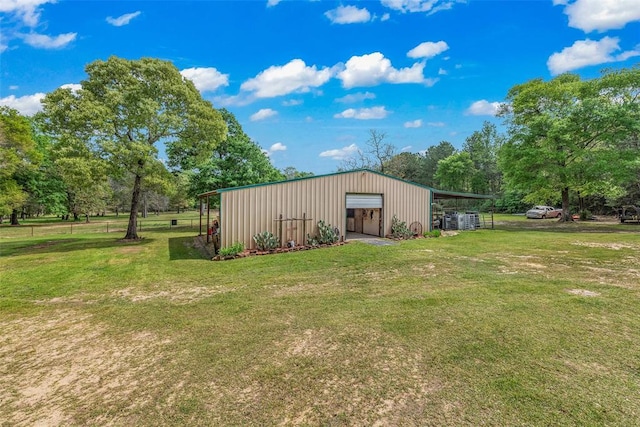 view of outbuilding with a yard