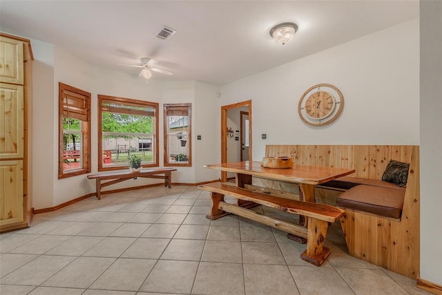 dining room with light tile patterned flooring and ceiling fan