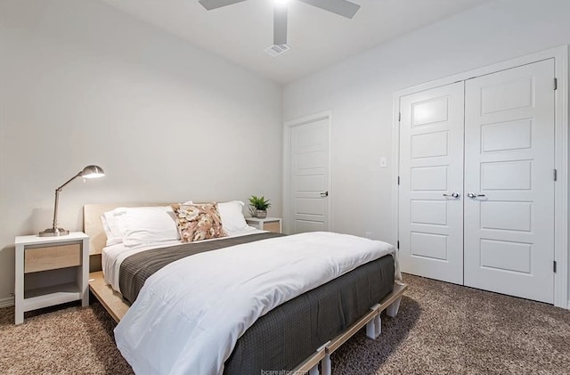 carpeted bedroom with a closet and ceiling fan