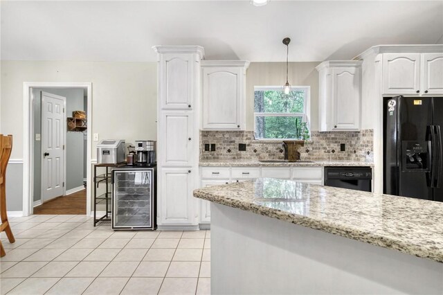 5303 Creek Ln, College Station, TX 77845 - kitchen with wine cooler, a sink, black appliances, and white cabinets