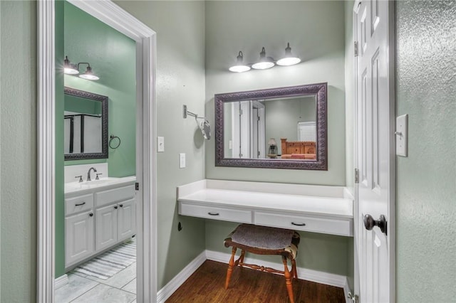 5303 Creek Ln, College Station, TX 77845 - bathroom featuring vanity, baseboards, and wood finished floors