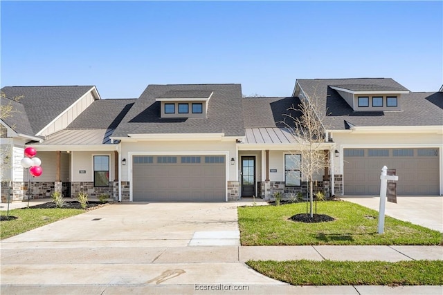 view of front of house with a garage and a front lawn