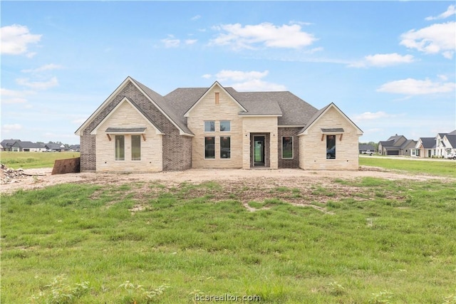 view of front of home with a front yard