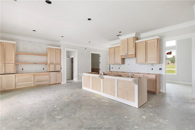 kitchen featuring light brown cabinets and crown molding