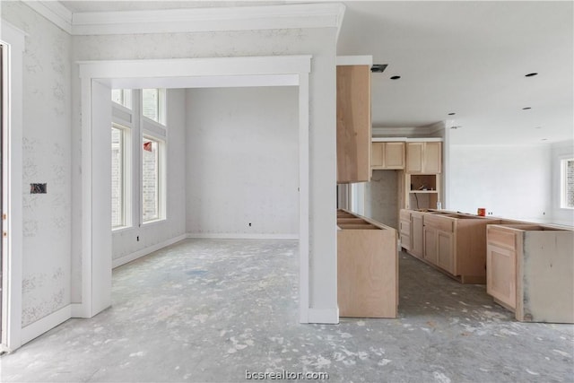 kitchen featuring ornamental molding and light brown cabinetry