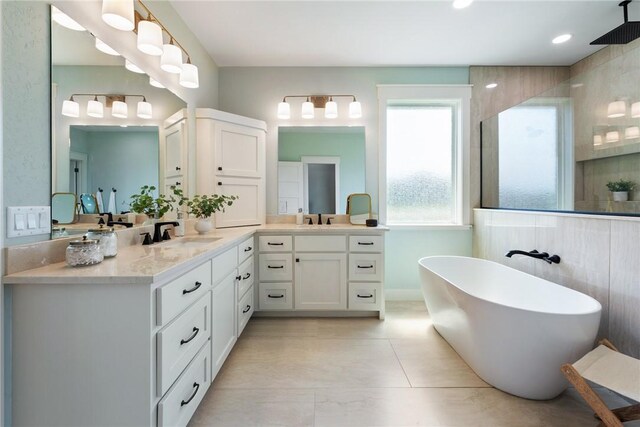 7800 Mathis Creek Dr, Bryan, TX 77808 - full bathroom with vanity, a soaking tub, and walk in shower