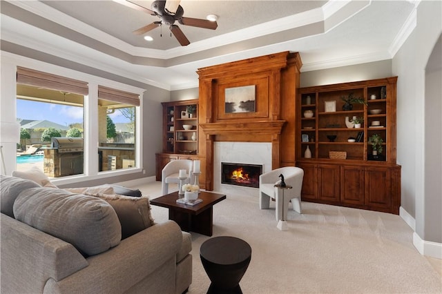 5106 Bellerive Bend Dr, College Station, TX 77845 - living room with light colored carpet, a high end fireplace, ornamental molding, and a raised ceiling