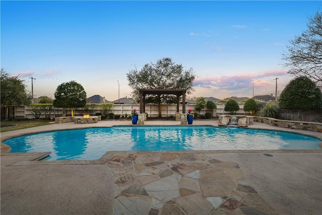 5106 Bellerive Bend Dr, College Station, TX 77845 - pool at dusk with a patio, a fire pit, a fenced backyard, and a fenced in pool