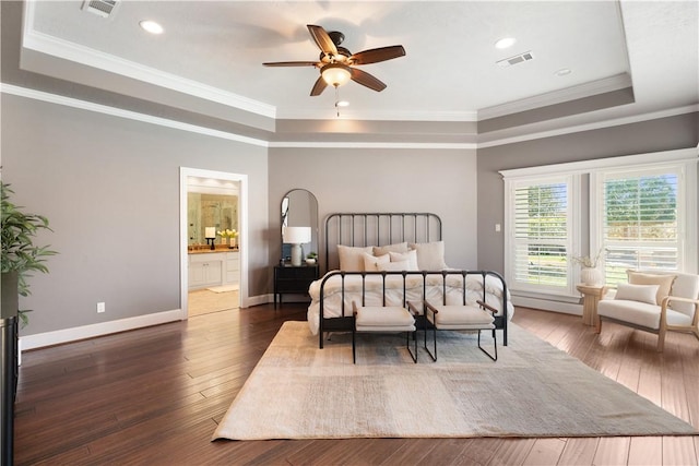 5106 Bellerive Bend Dr, College Station, TX 77845 - bedroom with wood-type flooring, ornamental molding, baseboards, a raised ceiling, and visible vents