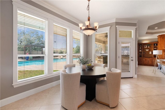 5106 Bellerive Bend Dr, College Station, TX 77845 - dining room featuring baseboards, light tile patterned floors, an inviting chandelier, and crown molding