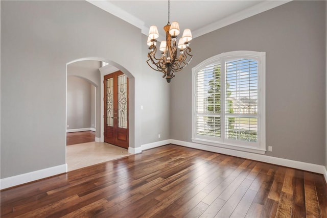 5106 Bellerive Bend Dr, College Station, TX 77845 - unfurnished room featuring baseboards, wood finished floors, and arched walkways