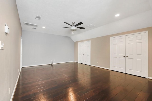 5106 Bellerive Bend Dr, College Station, TX 77845 - unfurnished bedroom featuring lofted ceiling, wood-type flooring, baseboards, multiple closets, and visible vents