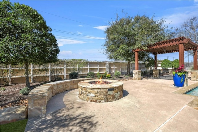 5106 Bellerive Bend Dr, College Station, TX 77845 - view of patio featuring a fenced backyard, an outdoor fire pit, and a pergola