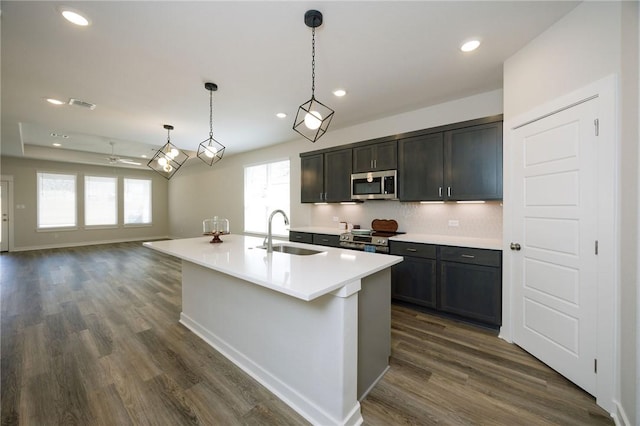 2778 Messenger Way, Bryan, TX 77803 - kitchen featuring a sink, stainless steel appliances, dark wood-style floors, light countertops, and recessed lighting