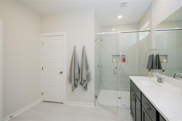 2778 Messenger Way, Bryan, TX 77803 - full bathroom with baseboards, a stall shower, and vanity