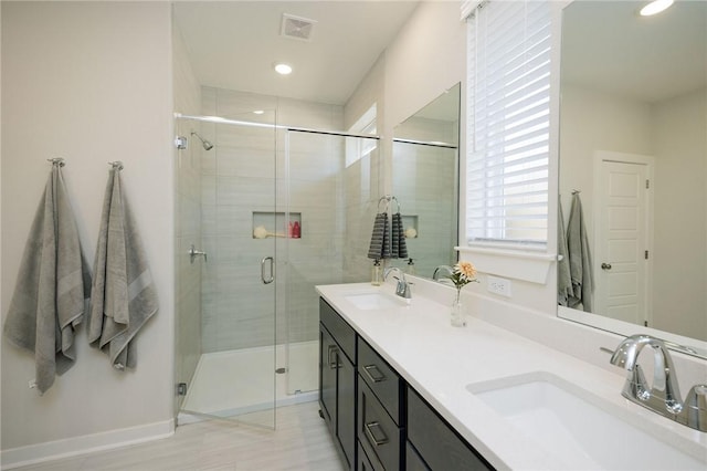2778 Messenger Way, Bryan, TX 77803 - full bath with a shower stall, double vanity, baseboards, and recessed lighting