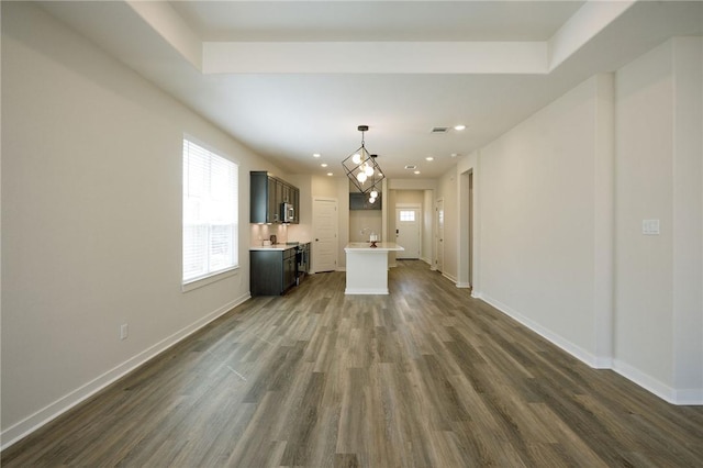 2778 Messenger Way, Bryan, TX 77803 - unfurnished living room featuring dark wood-style floors, baseboards, and recessed lighting