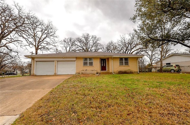 ranch-style house featuring a garage and a front lawn