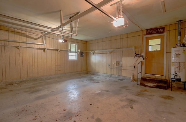 garage featuring a garage door opener and gas water heater