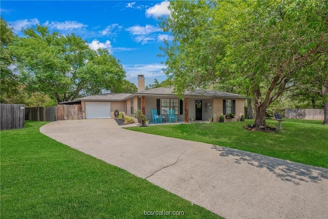 single story home featuring a front lawn and a garage