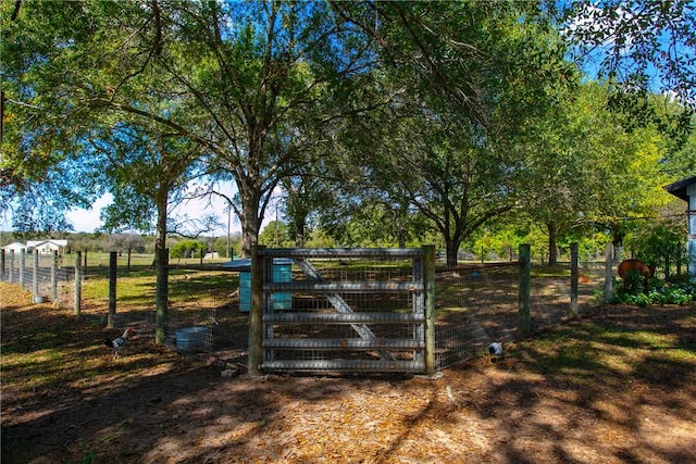 view of gate featuring a rural view