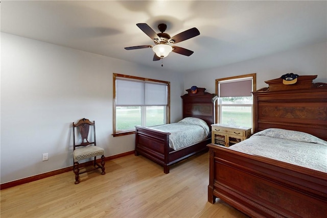 bedroom featuring ceiling fan and light hardwood / wood-style flooring