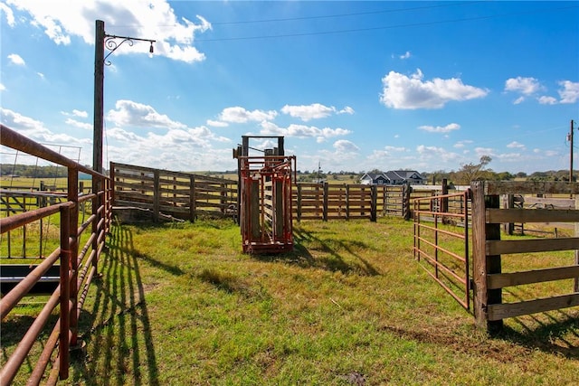 view of yard with a rural view