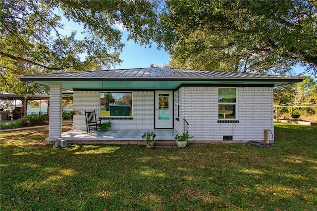 back of house with a yard