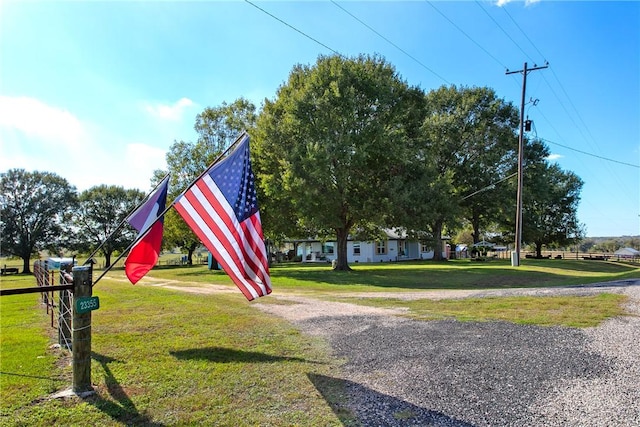 surrounding community with a yard