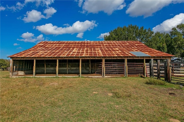 back of property featuring an outbuilding