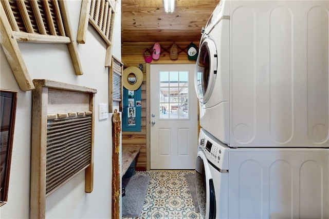 laundry area with stacked washer and clothes dryer and wood ceiling