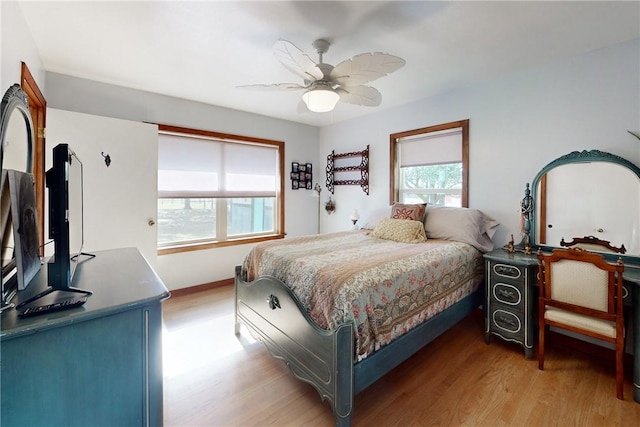 bedroom featuring ceiling fan and light wood-type flooring