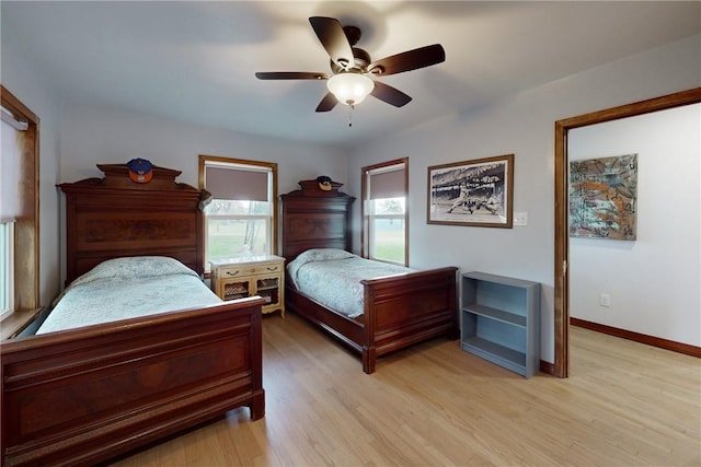 bedroom with light hardwood / wood-style flooring and ceiling fan