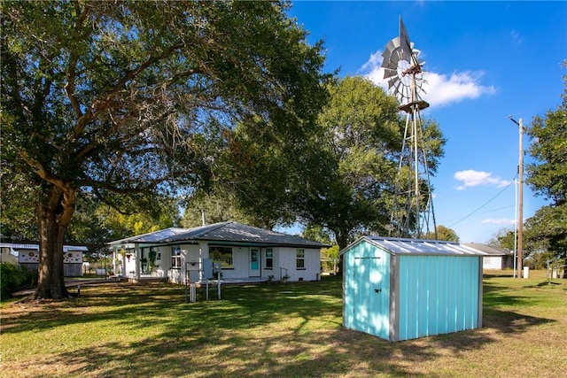 exterior space featuring a yard and a shed