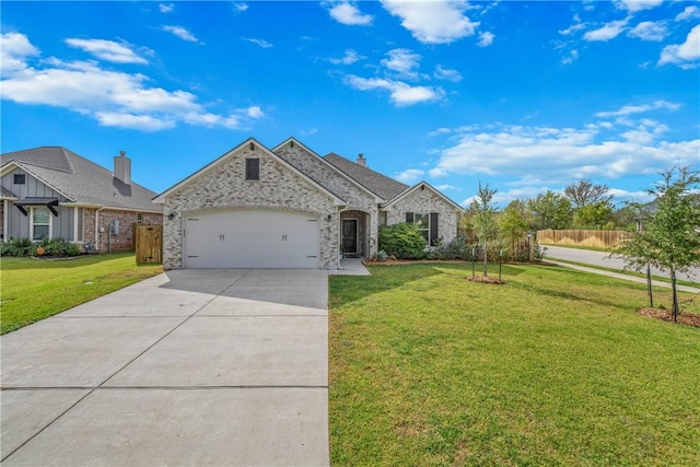 view of front of property with a front lawn and a garage