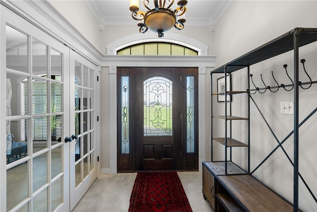 9560 County Road 121, Iola, TX 77861 - foyer entrance featuring french doors, crown molding, and a chandelier