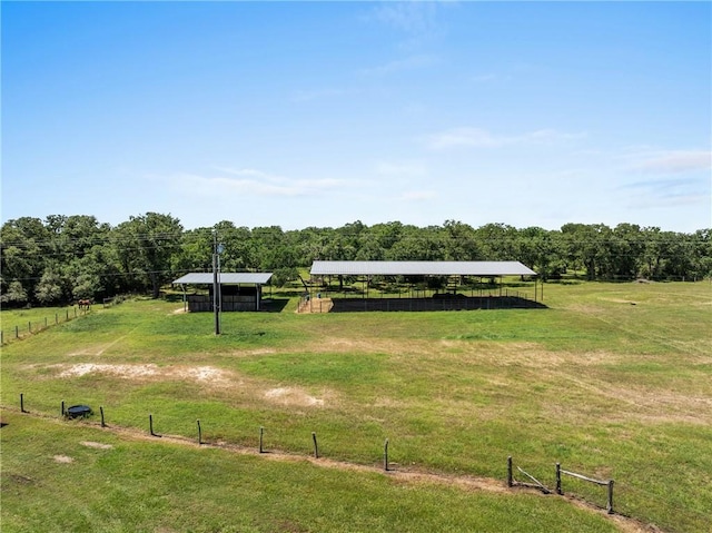 9560 County Road 121, Iola, TX 77861 - view of home's community featuring a detached carport, a rural view, and an outdoor structure