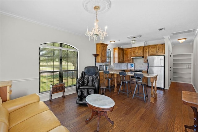 9560 County Road 121, Iola, TX 77861 - living area featuring healthy amount of natural light, crown molding, dark wood-style flooring, a chandelier, and baseboards
