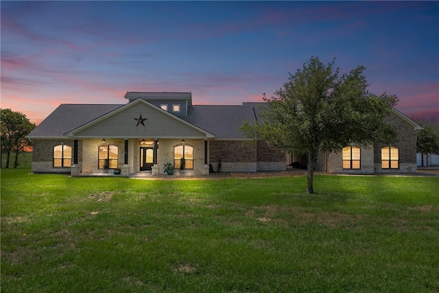 9560 County Road 121, Iola, TX 77861 - back of property featuring a ceiling fan, covered porch, and a lawn
