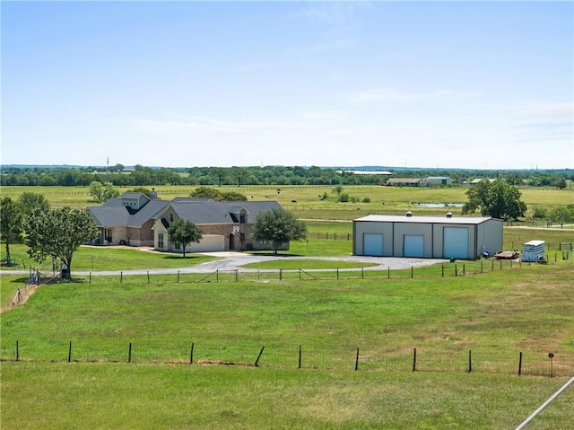 9560 County Road 121, Iola, TX 77861 - view of yard with a rural view, an outdoor structure, and driveway
