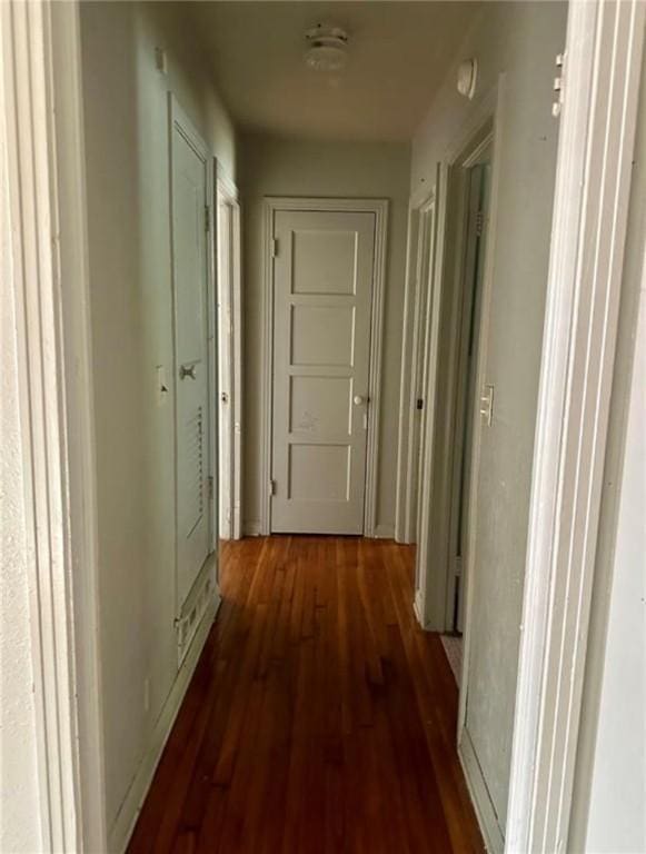 hall with dark hardwood / wood-style flooring